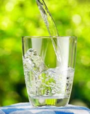 Pouring water into glass