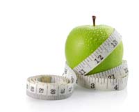 Tape measure wrapped around apple